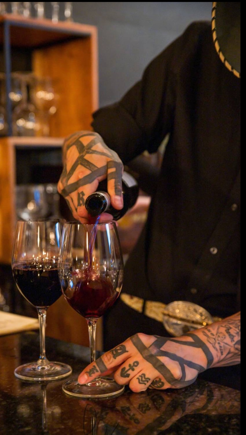 Wine being poured for guests at Malvagio’s